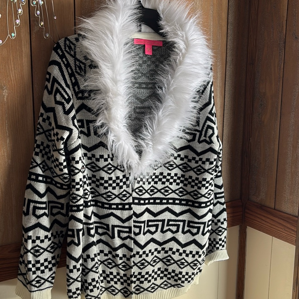 Winter black and white cardigan with fur trim.